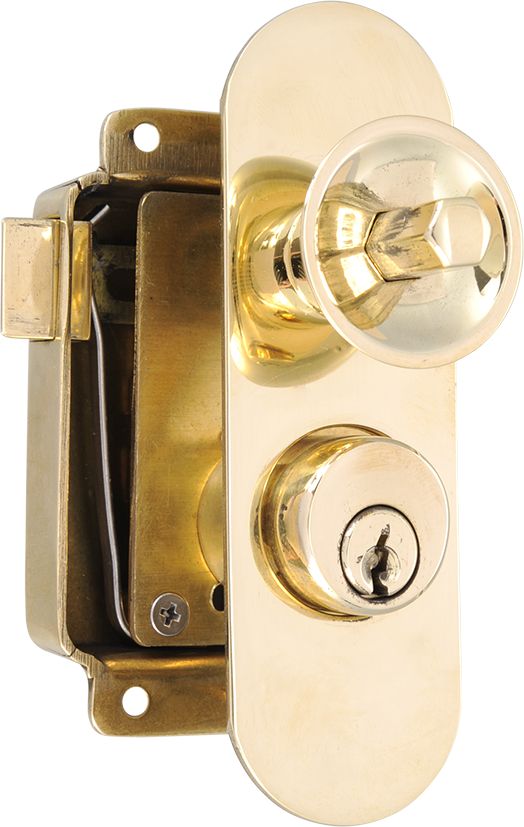 Cupboard rim lock with key cylinder